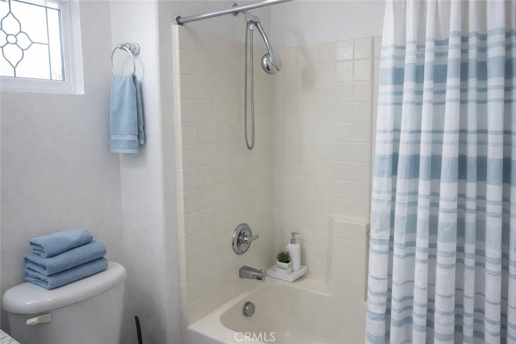 1285 Fools Gold Way, Unit 2 Chula Vista, CA 91913 - Photo 24 of 43 a bathroom with a shower toilet and sink