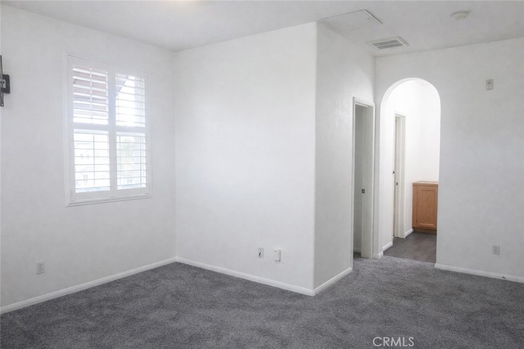 1285 Fools Gold Way, Unit 2 Chula Vista, CA 91913 - Photo 32 of 43 an empty room with windows and closet