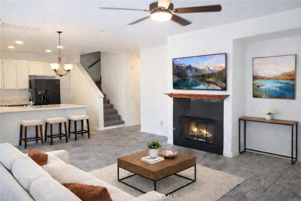 1285 Fools Gold Way, Unit 2 Chula Vista, CA 91913 - Photo 6 of 43 a living room with furniture and a fireplace