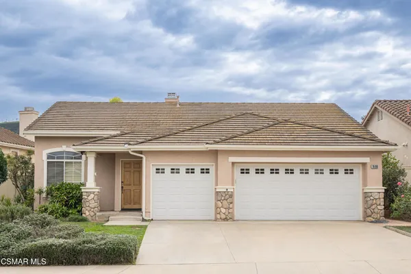 a view of a house with basketball court