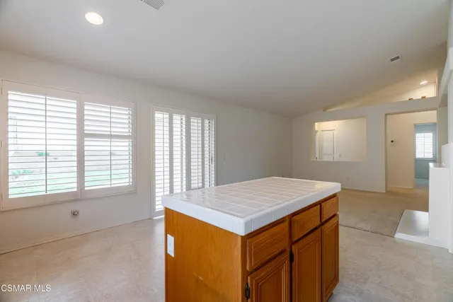 a room that has a bed and a table in it