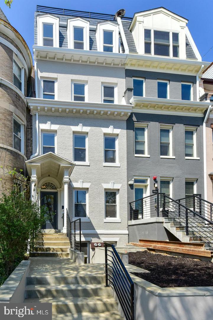 1453 Girard Street Northwest, Unit 3 Washington, DC 20009 - Photo 1 of 21 a front view of a residential apartment building with a yard