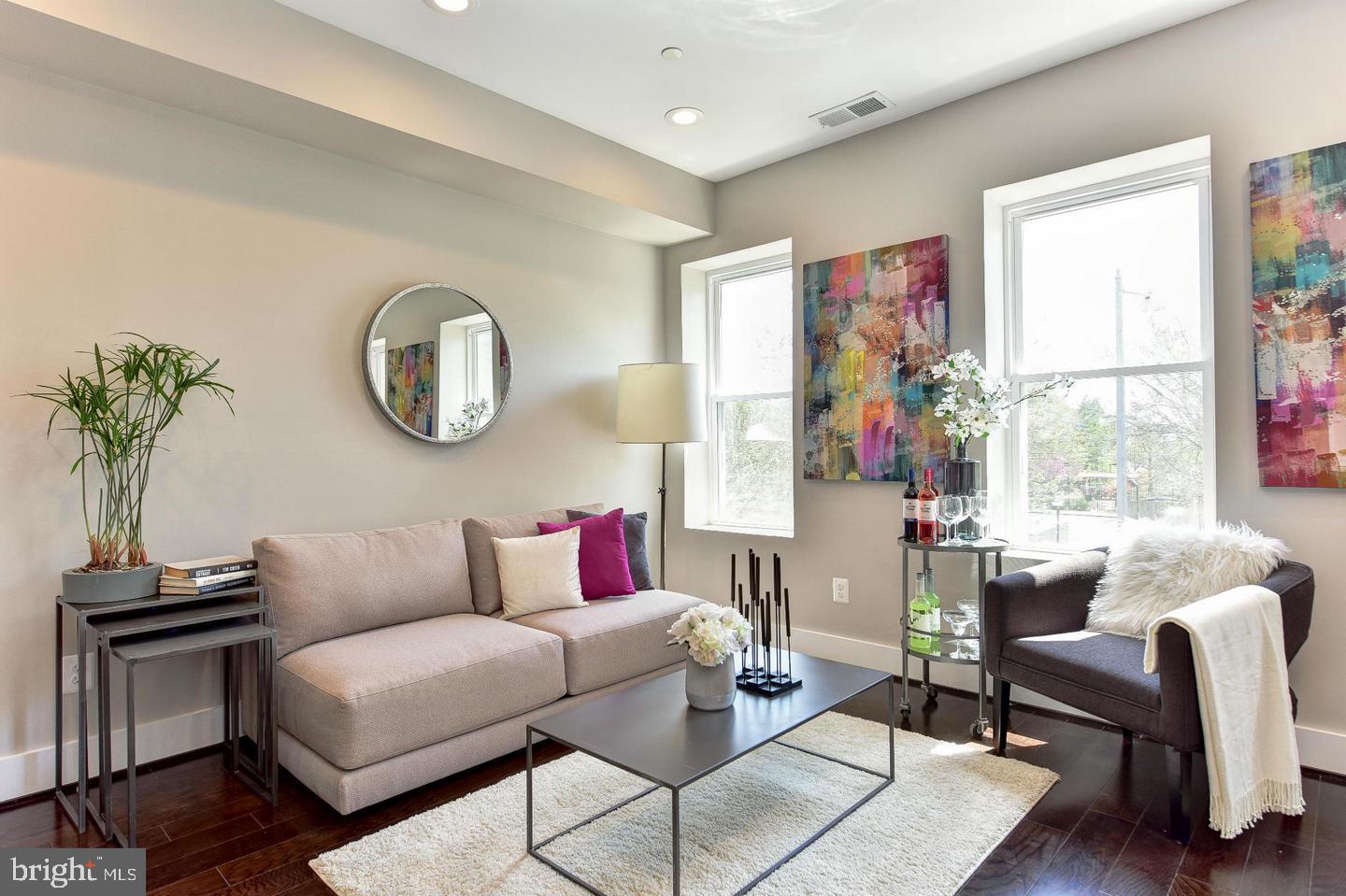 1453 Girard Street Northwest, Unit 3 Washington, DC 20009 - Photo 3 of 21 a living room with furniture and a large window