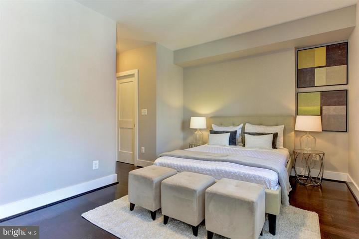 1453 Girard Street Northwest, Unit 3 Washington, DC 20009 - Photo 10 of 21 a bedroom with a bed and a window
