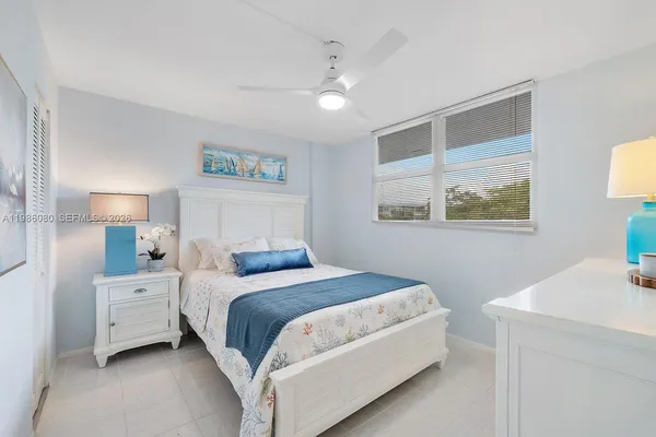 a bedroom with a bed and a table