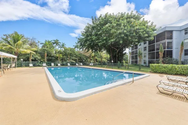 a view of outdoor space and swimming pool