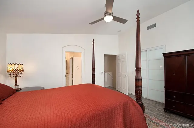 a bedroom with a bed and a dresser