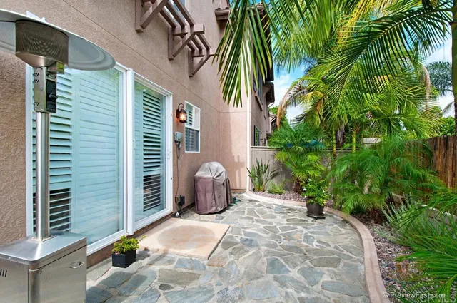 a view of backyard with potted plants