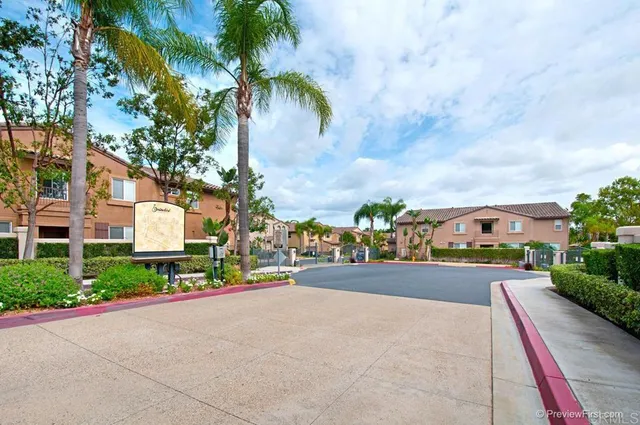 a view of a street with a building in the background
