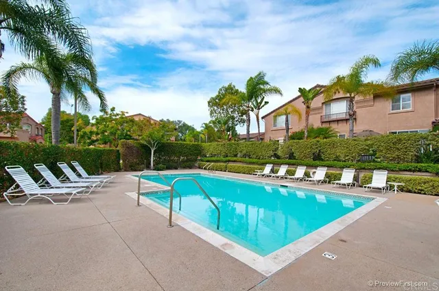 a view of a swimming pool with a lounge chairs