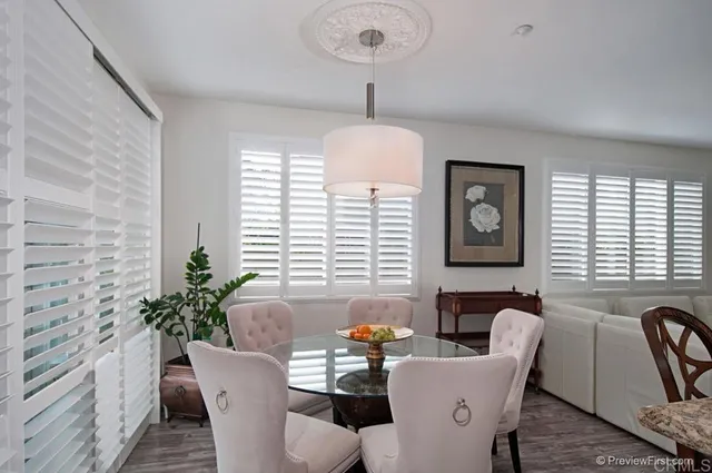 a view of a dining room with furniture window and outside view