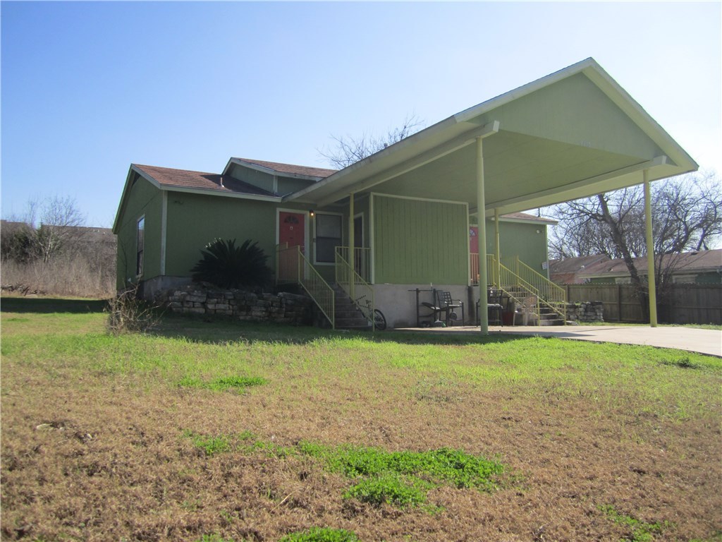 2213 Yellow Jacket Lane, Unit B Austin, TX 78741 - Photo 1 of 6 a backyard of a house with barbeque oven