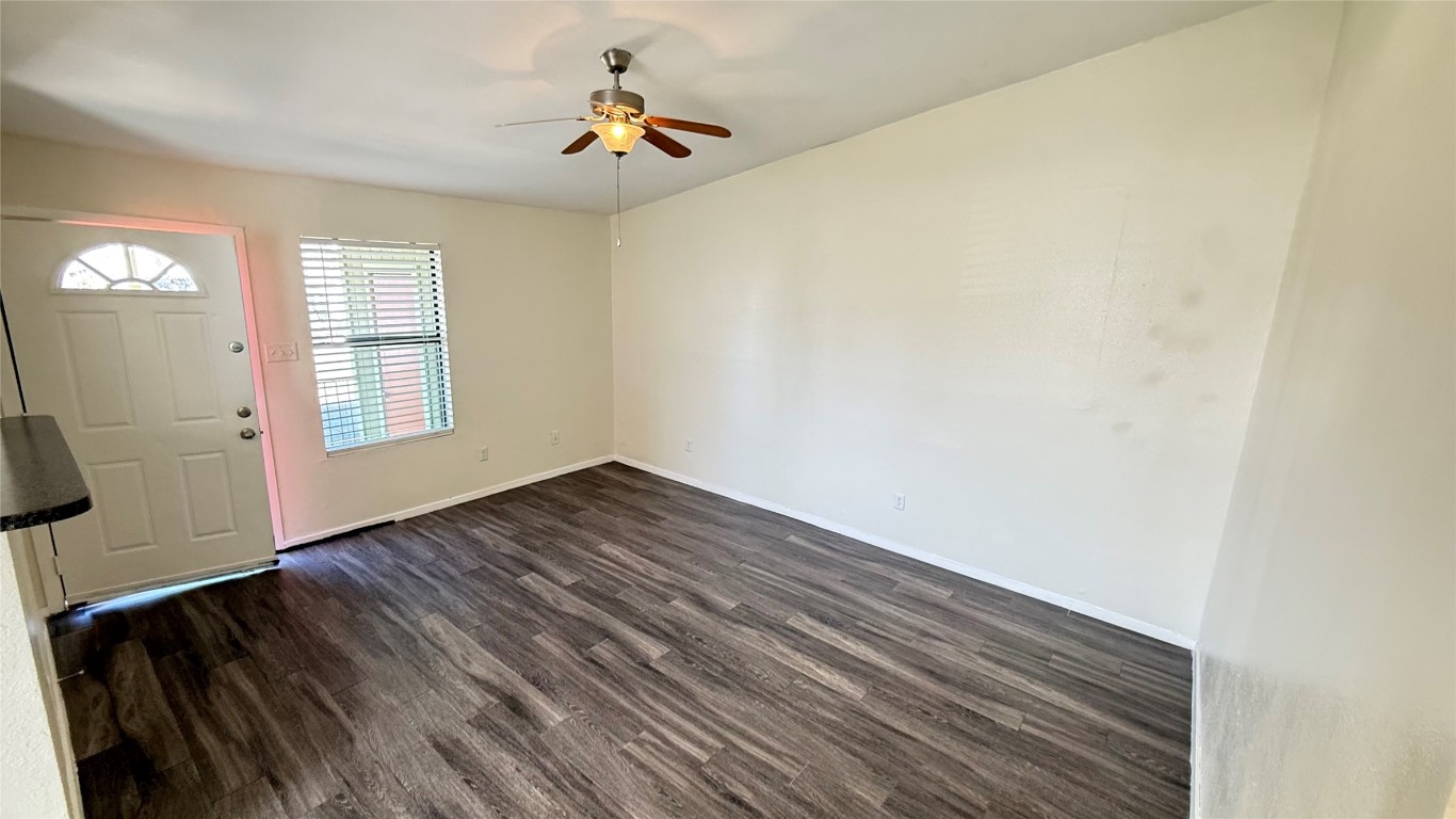 2213 Yellow Jacket Lane, Unit B Austin, TX 78741 - Photo 3 of 6 a view of empty room with wooden floor and fan