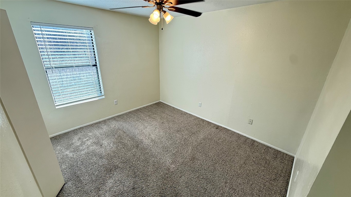 2213 Yellow Jacket Lane, Unit B Austin, TX 78741 - Photo 4 of 6 an empty room with a window