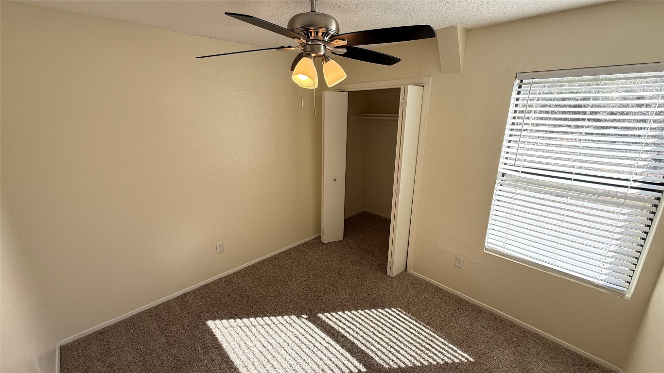 2213 Yellow Jacket Lane, Unit B Austin, TX 78741 - Photo 5 of 6 a view of a room with a window and a ceiling fan