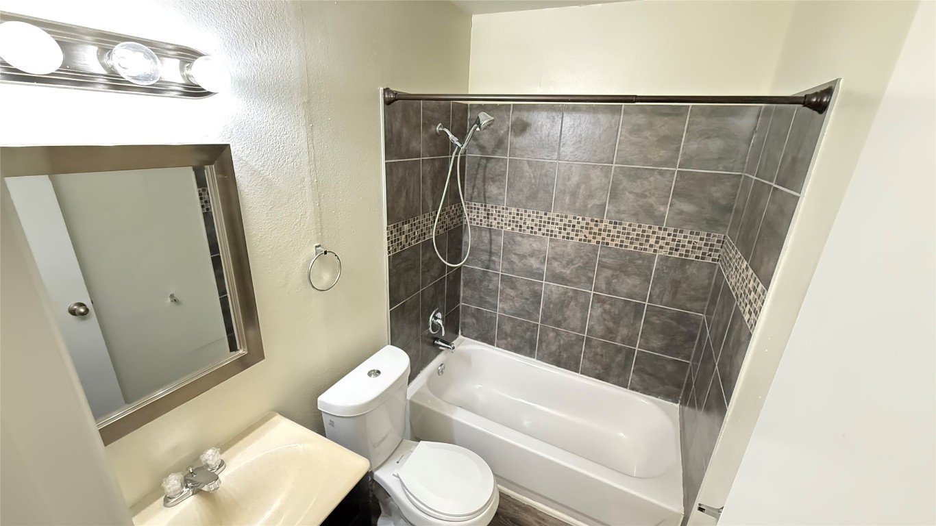 2213 Yellow Jacket Lane, Unit B Austin, TX 78741 - Photo 6 of 6 a bathroom with a toilet and a shower