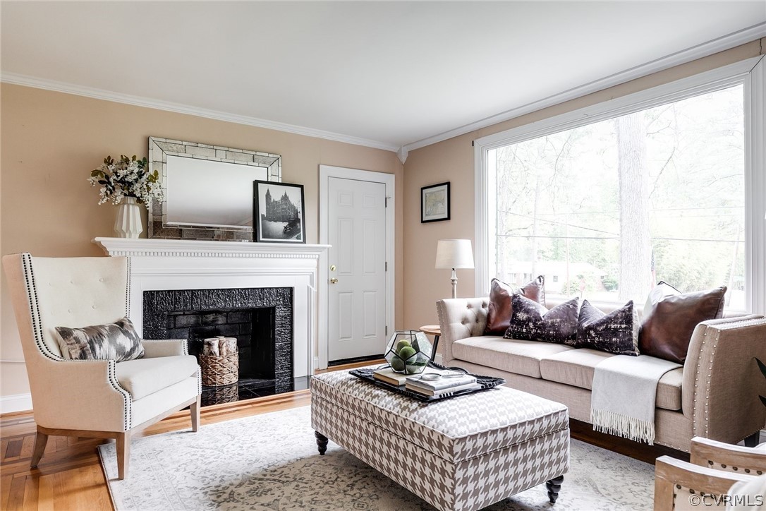 7547 Cherokee Road Richmond, VA 23225 - Photo 23 of 29 a living room with furniture and a fireplace