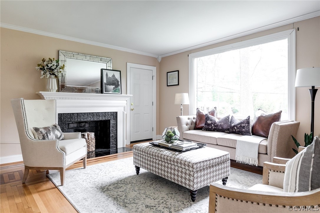 7547 Cherokee Road Richmond, VA 23225 - Photo 5 of 29 a living room with furniture and a fireplace