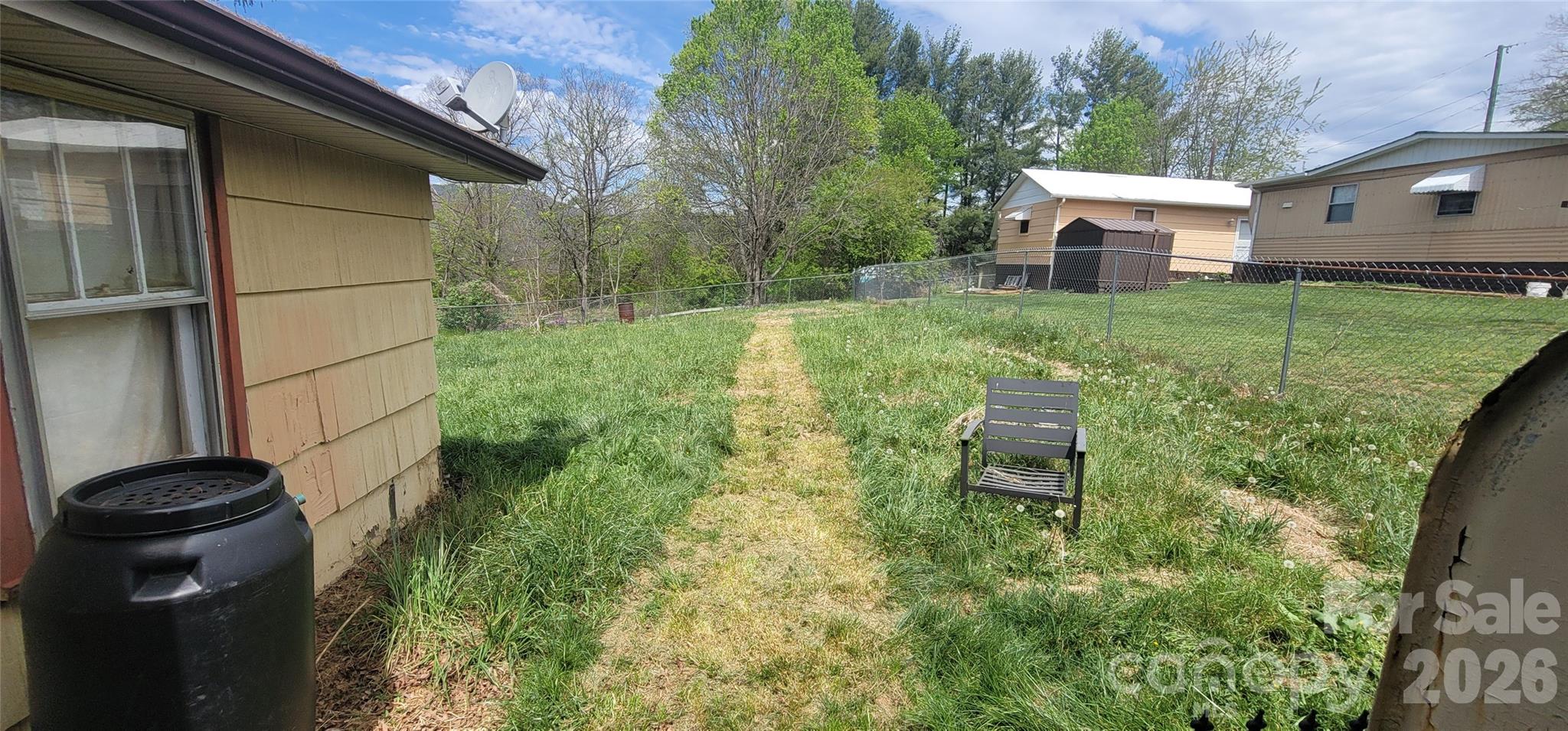 60 Mingus Street Canton, NC 28716 - Photo 11 of 14 a view of a chair and table in backyard of the house