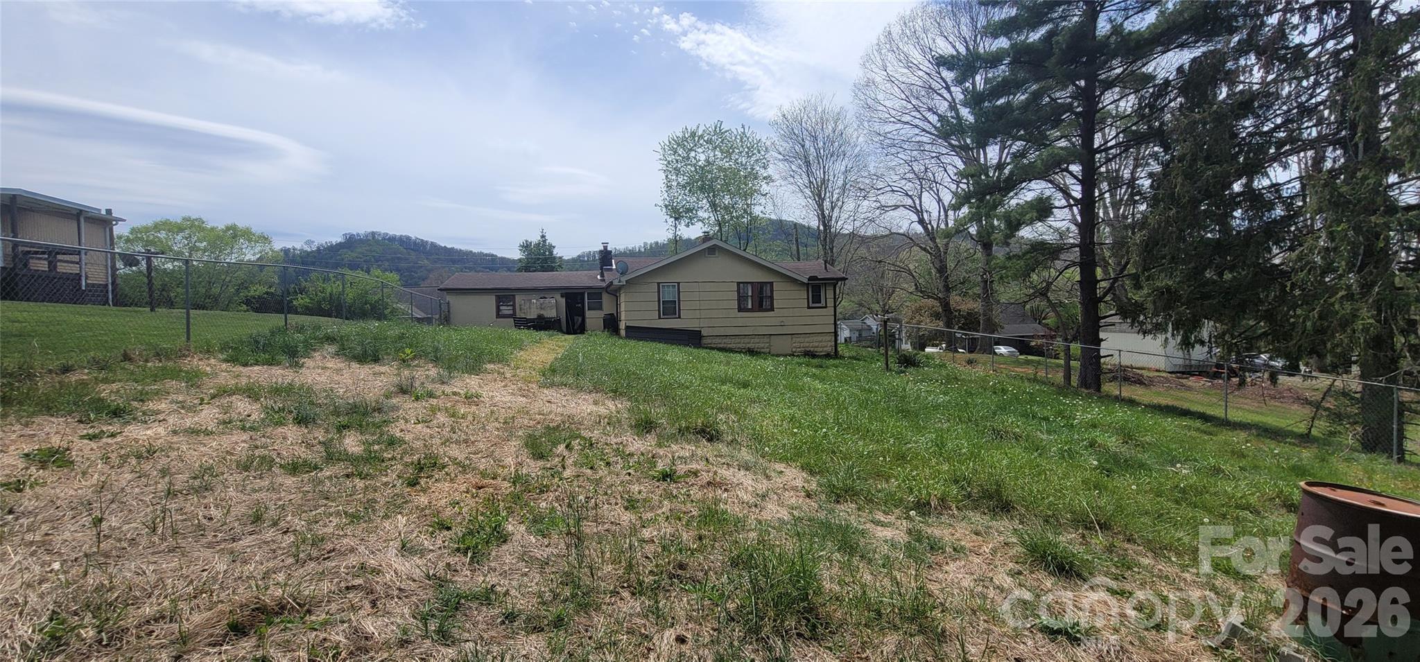 60 Mingus Street Canton, NC 28716 - Photo 13 of 14 a view of house with a big yard and large trees