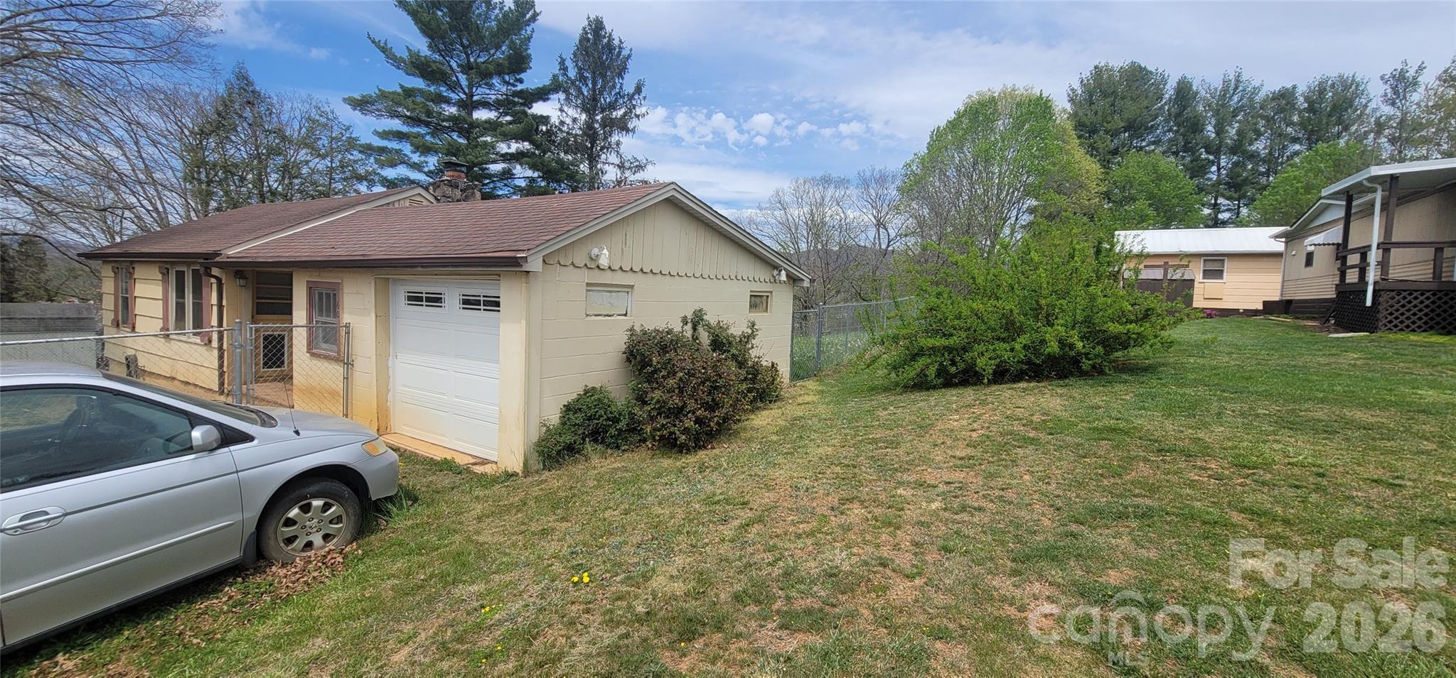 60 Mingus Street Canton, NC 28716 - Photo 3 of 14 a view of backyard with outdoor seating and green space