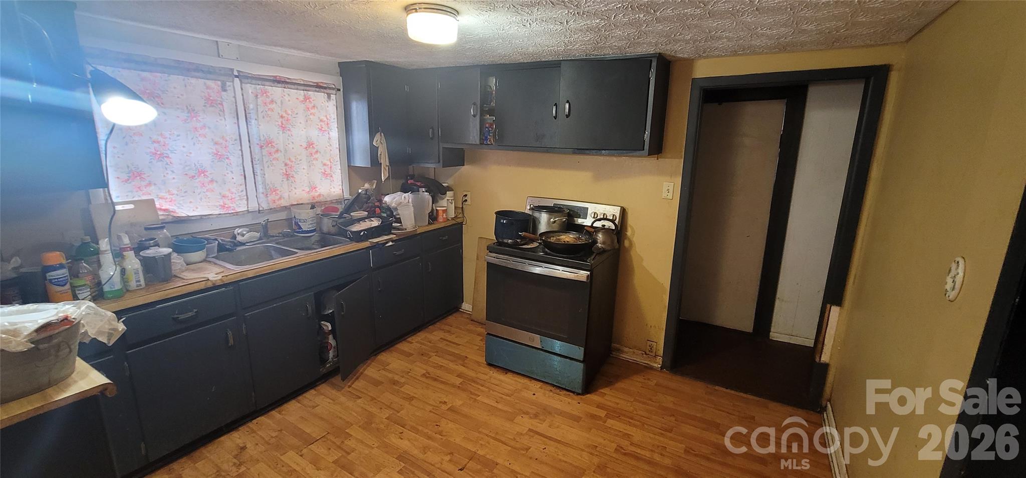 60 Mingus Street Canton, NC 28716 - Photo 5 of 14 a kitchen with a stove and a refrigerator