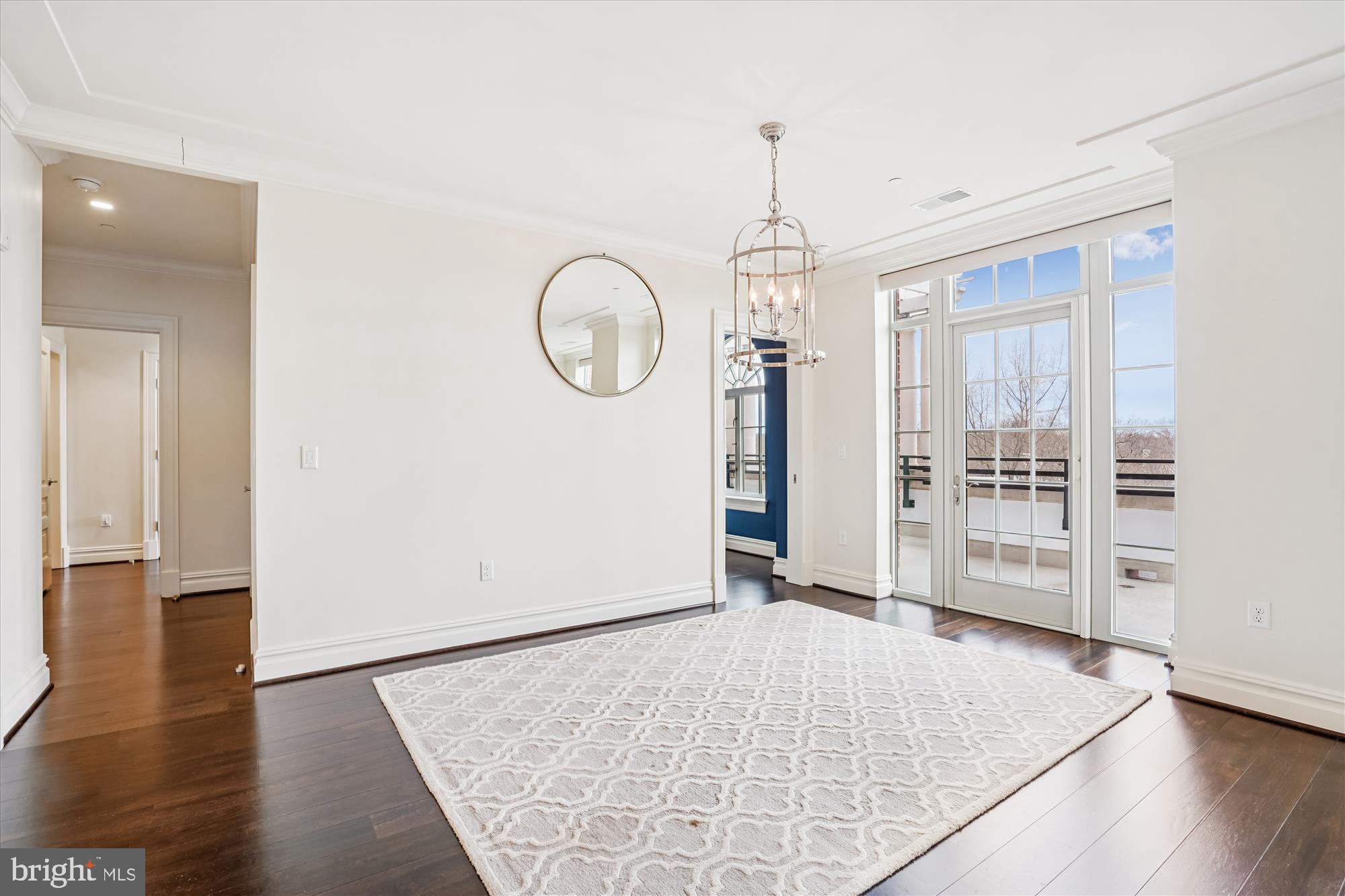 6900 Fleetwood Road, Unit 600 McLean, VA 22101 - Photo 6 of 32 an empty room with wooden floor and windows