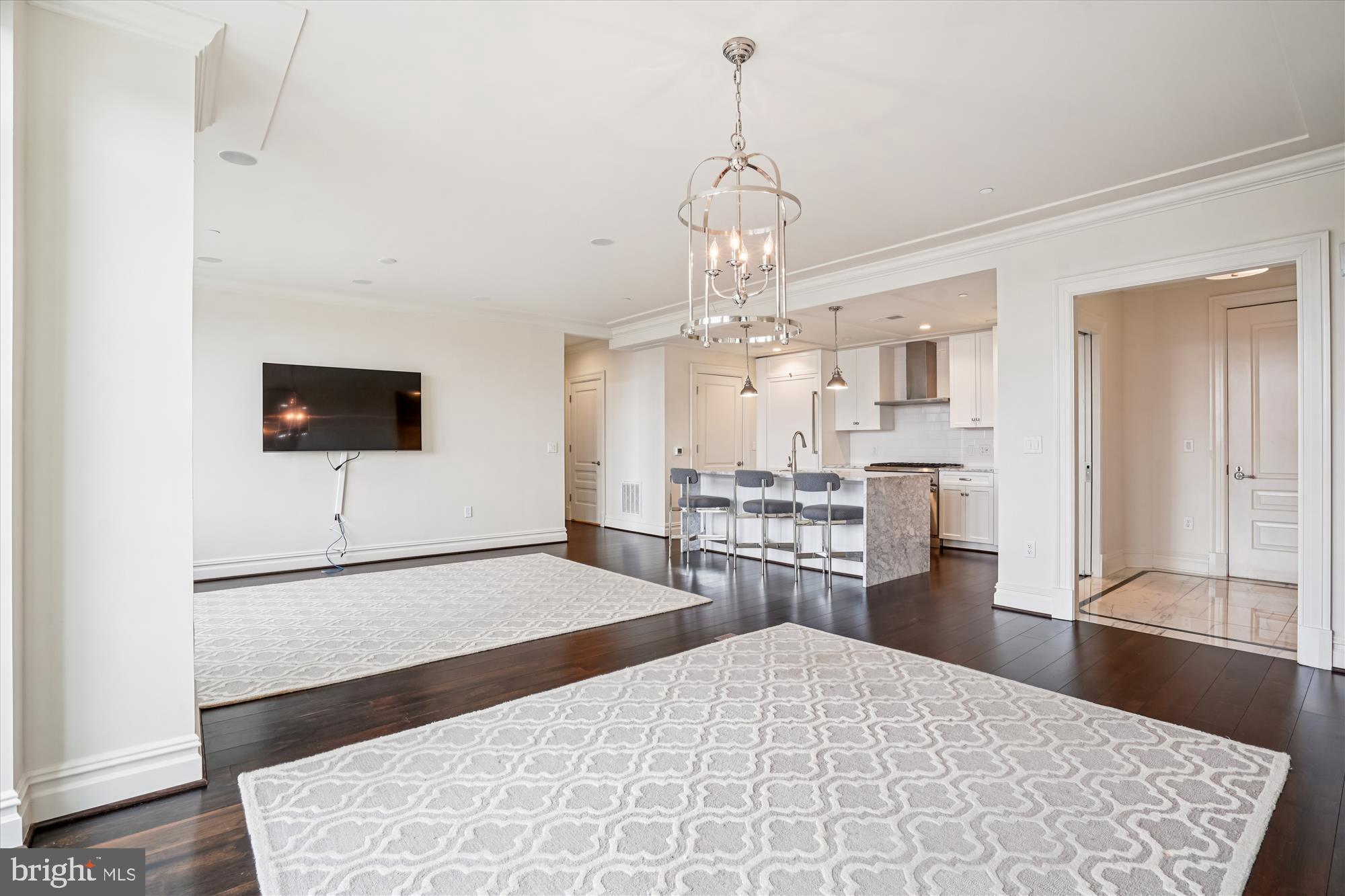 6900 Fleetwood Road, Unit 600 McLean, VA 22101 - Photo 7 of 32 a large bedroom with a bed and a flat screen tv