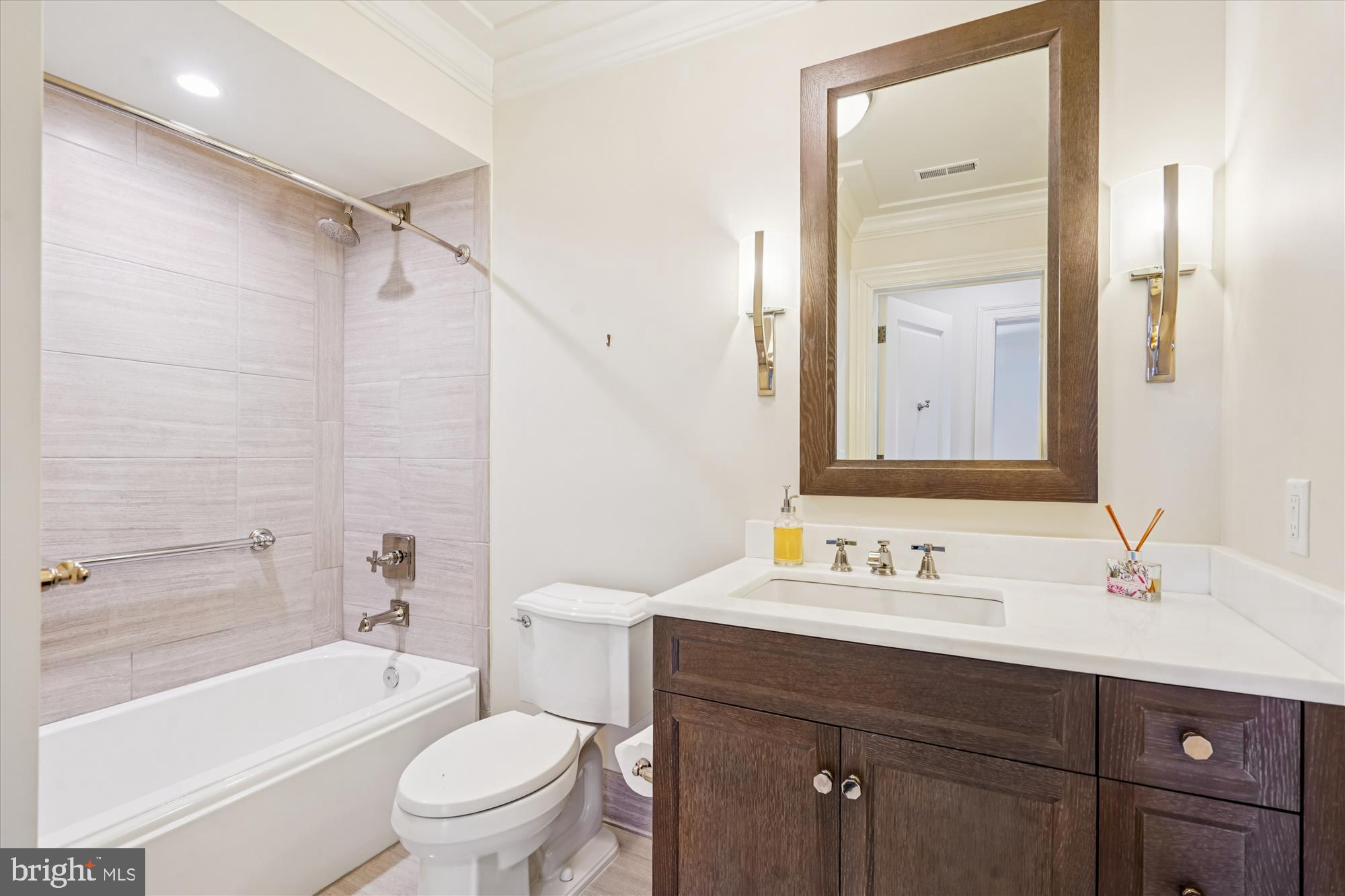 6900 Fleetwood Road, Unit 600 McLean, VA 22101 - Photo 9 of 32 a bathroom with a sink a toilet and shower