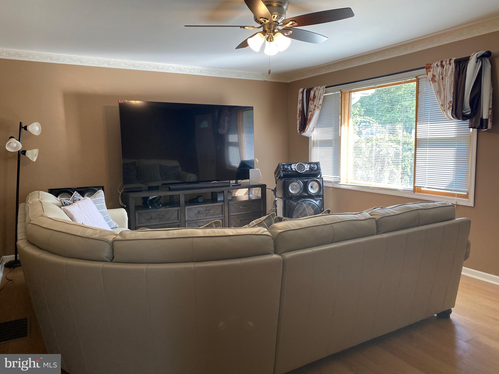 42 Harvard Road Pennsville, NJ 08070 - Photo 11 of 26 a living room with furniture and a flat screen tv