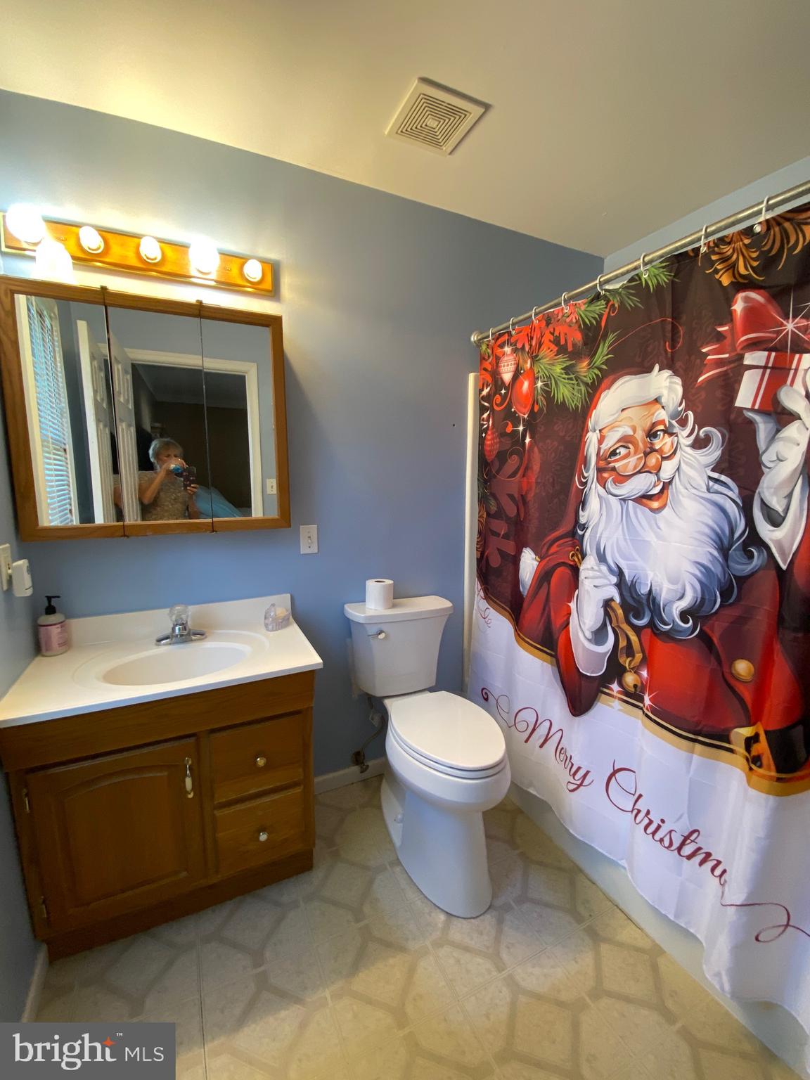 42 Harvard Road Pennsville, NJ 08070 - Photo 20 of 26 a bathroom with a toilet sink and mirror