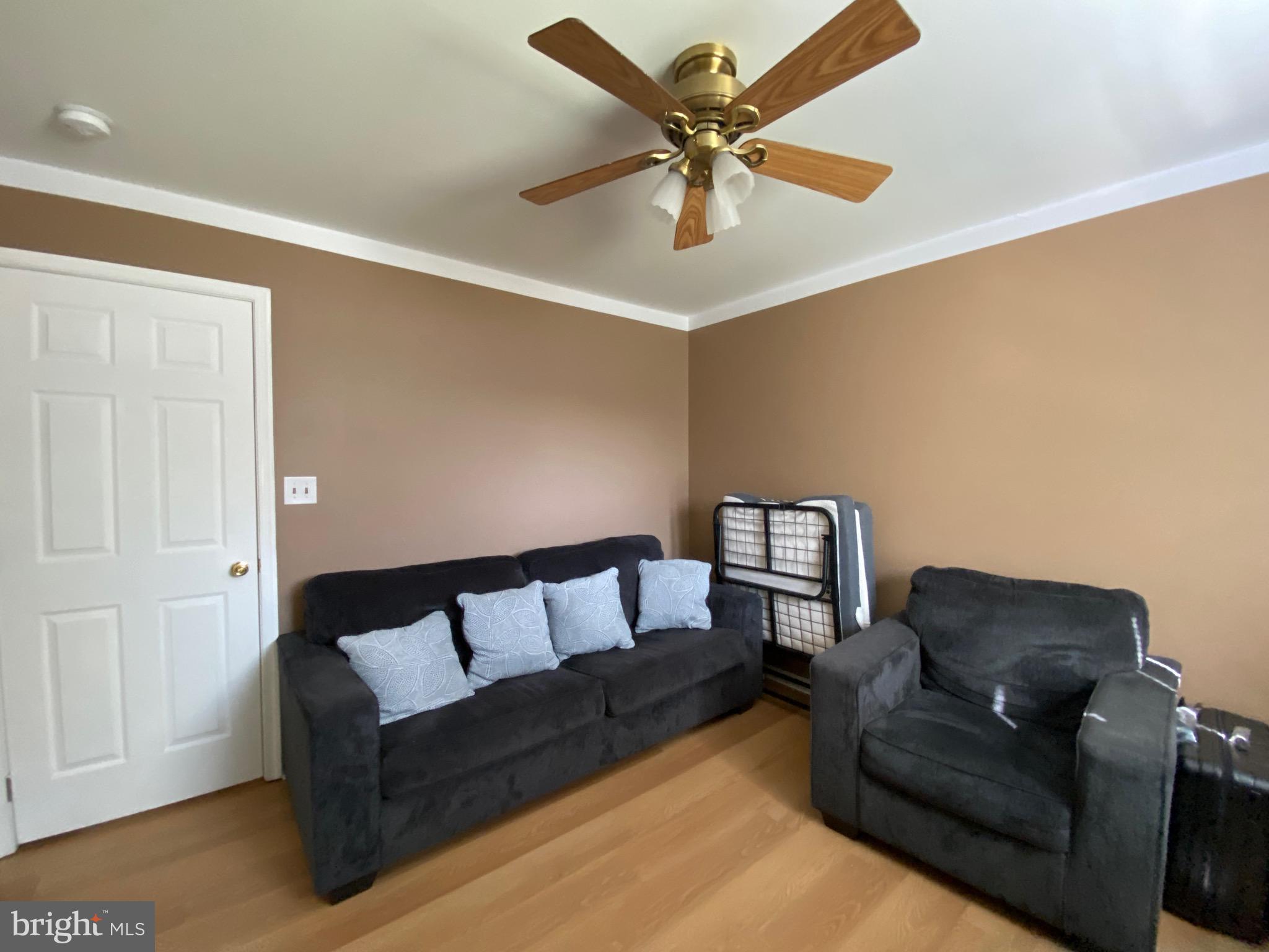 42 Harvard Road Pennsville, NJ 08070 - Photo 24 of 26 a living room with furniture and a ceiling fan