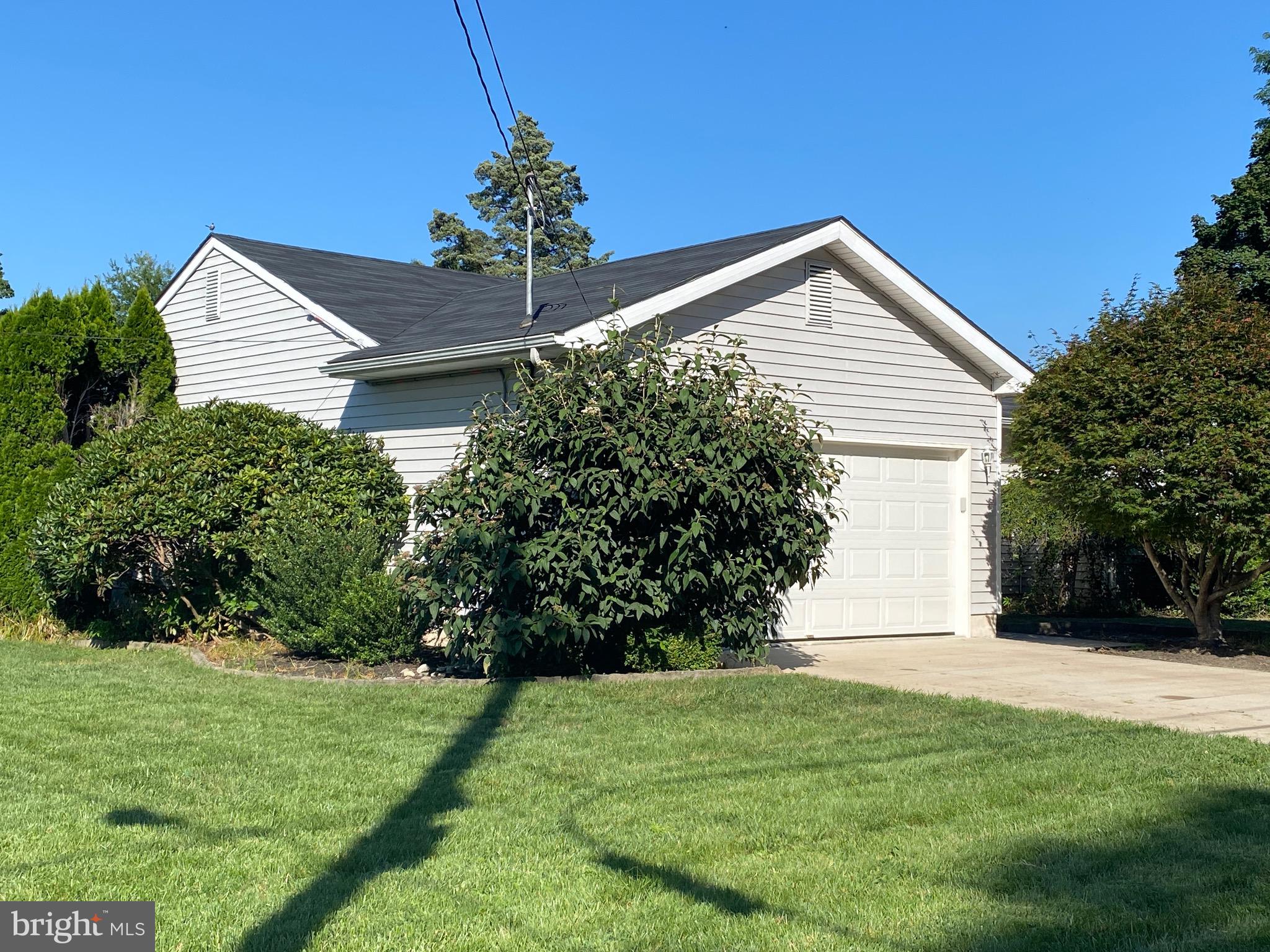 42 Harvard Road Pennsville, NJ 08070 - Photo 3 of 26 a front view of house with garden
