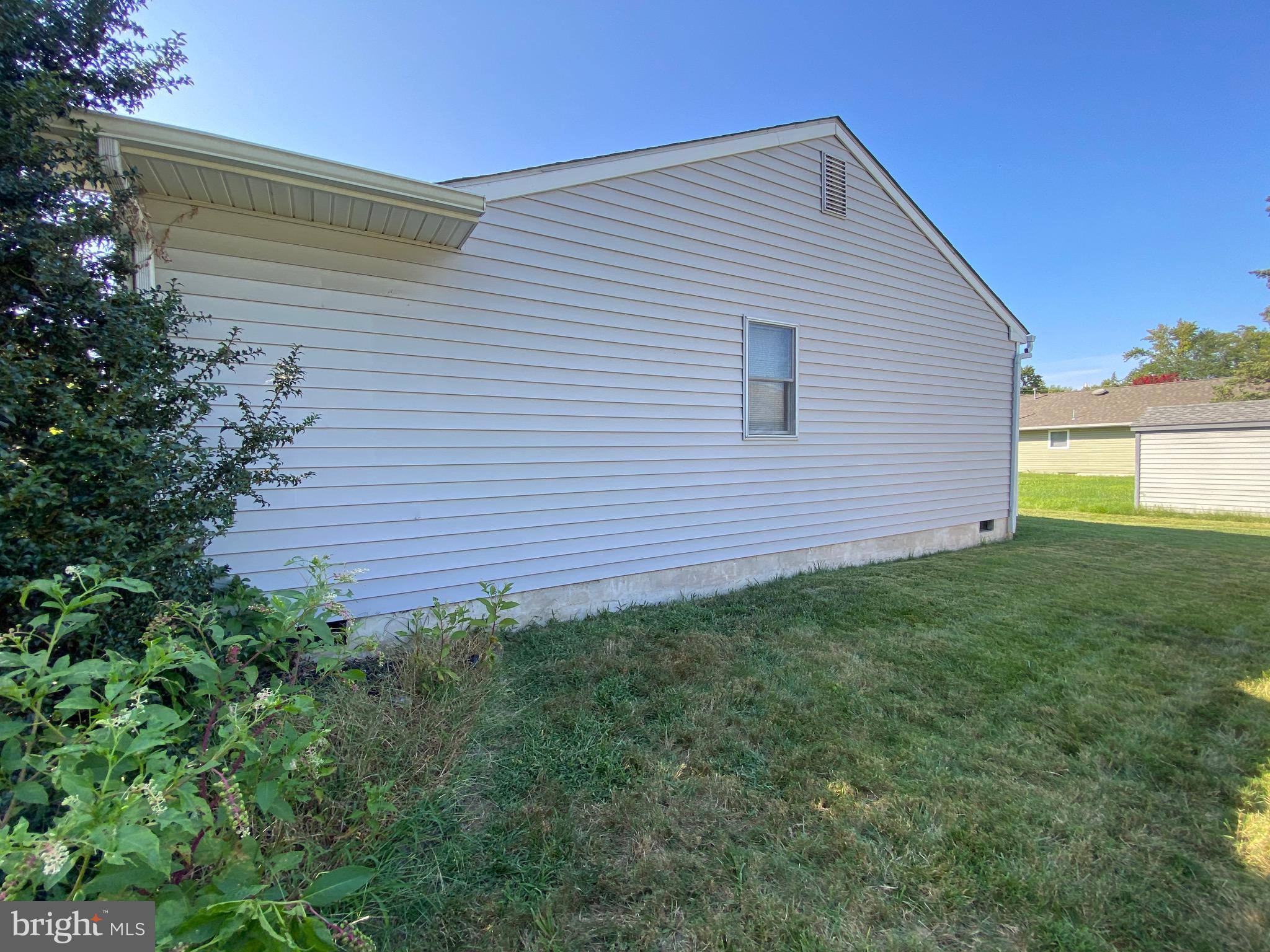 42 Harvard Road Pennsville, NJ 08070 - Photo 5 of 26 a view of a backyard with plants and a garden