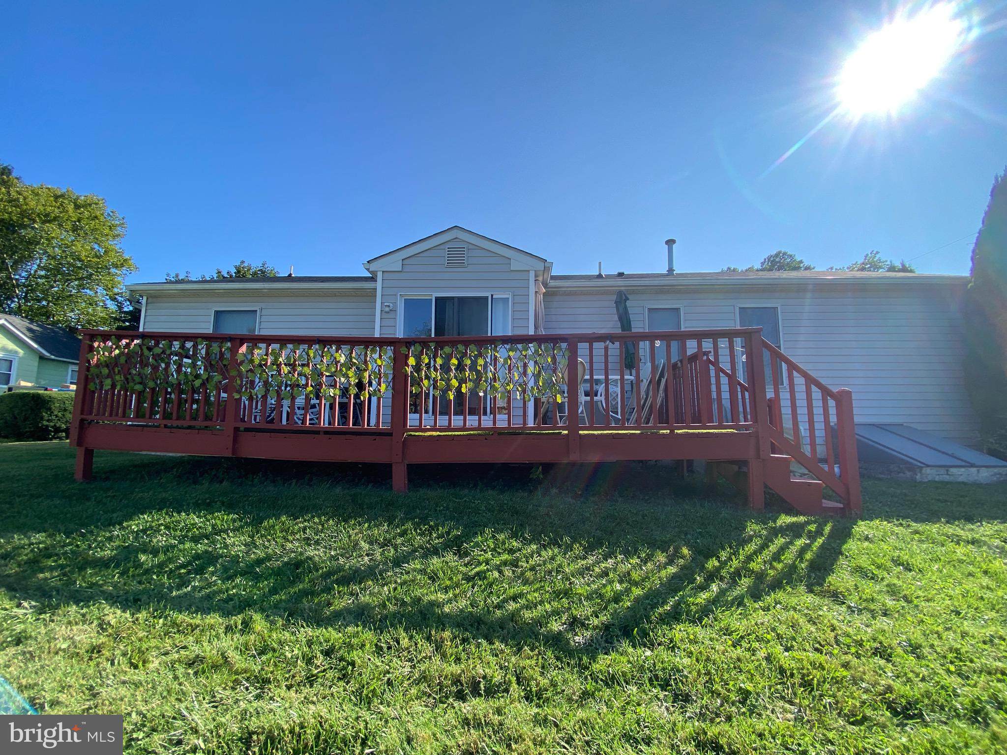 42 Harvard Road Pennsville, NJ 08070 - Photo 7 of 26 a view of a garden with a bench