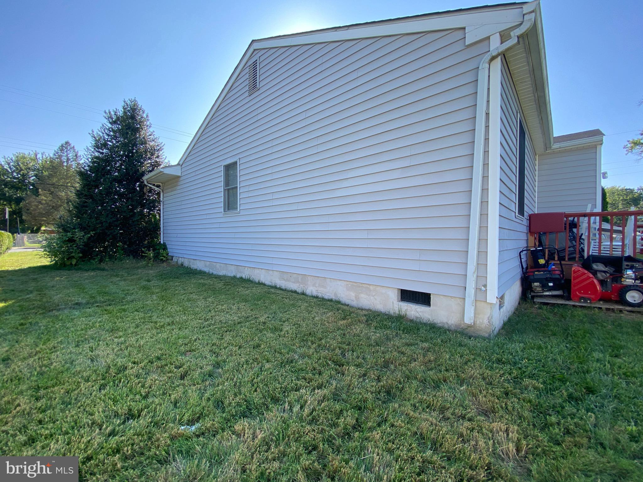 42 Harvard Road Pennsville, NJ 08070 - Photo 9 of 26 a view of a backyard with plants and a large tree