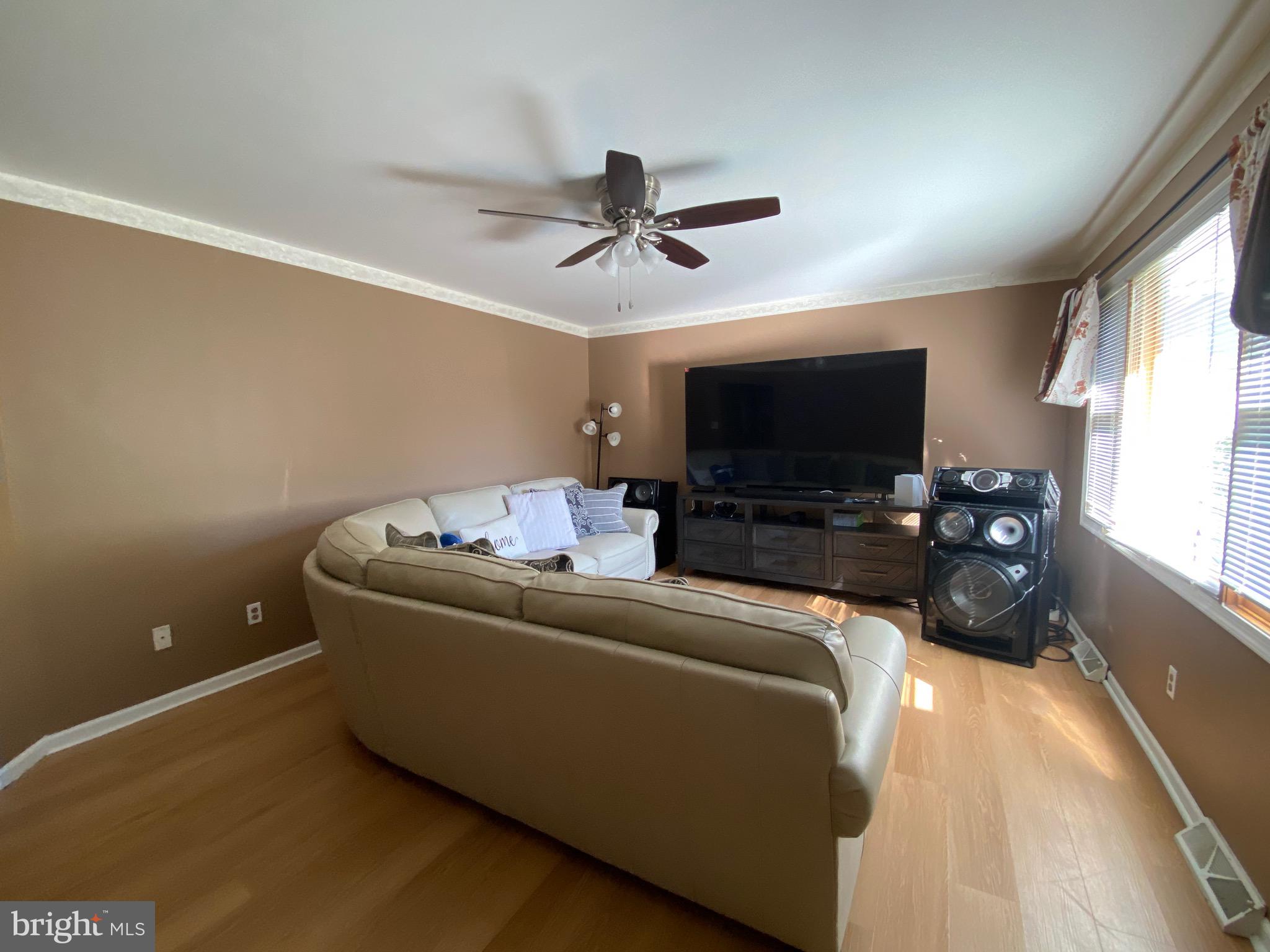 42 Harvard Road Pennsville, NJ 08070 - Photo 10 of 26 a living room with furniture and a flat screen tv