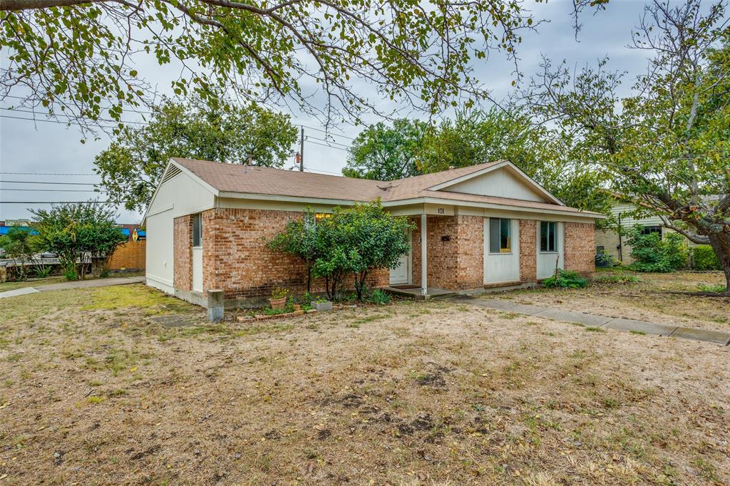 909 East Belt Line Road Richardson, TX 75081 - Photo 2 of 13 a view of a house with a yard