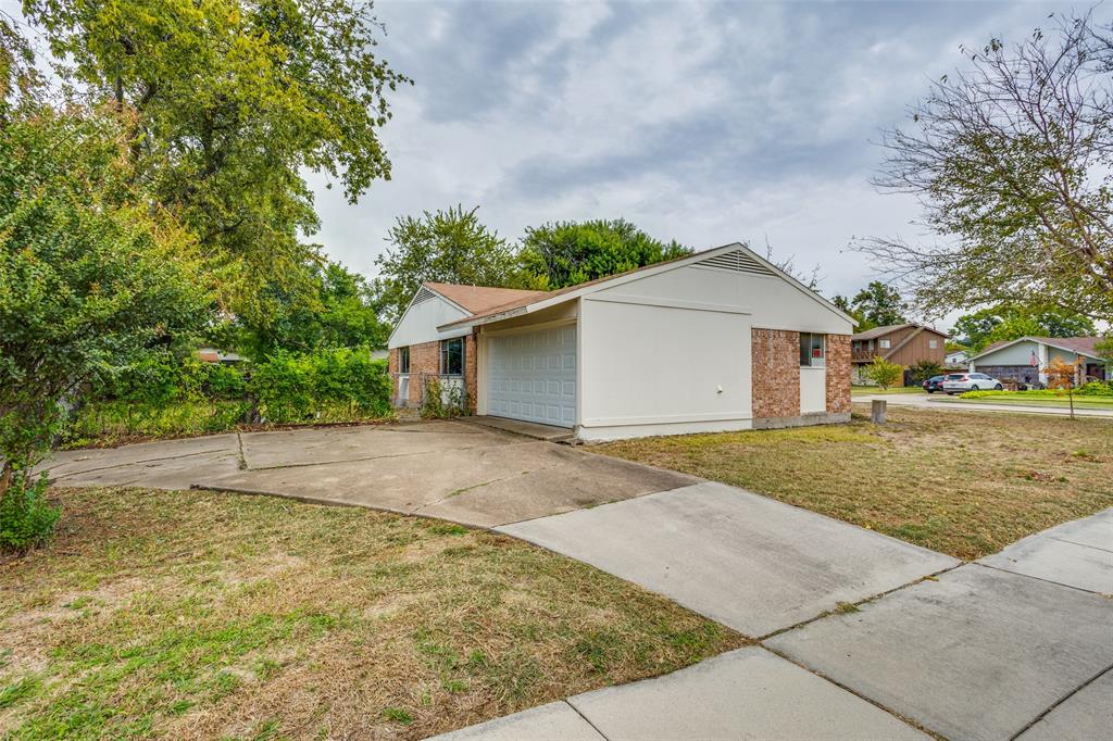 909 East Belt Line Road Richardson, TX 75081 - Photo 3 of 13 a view of outdoor space and yard
