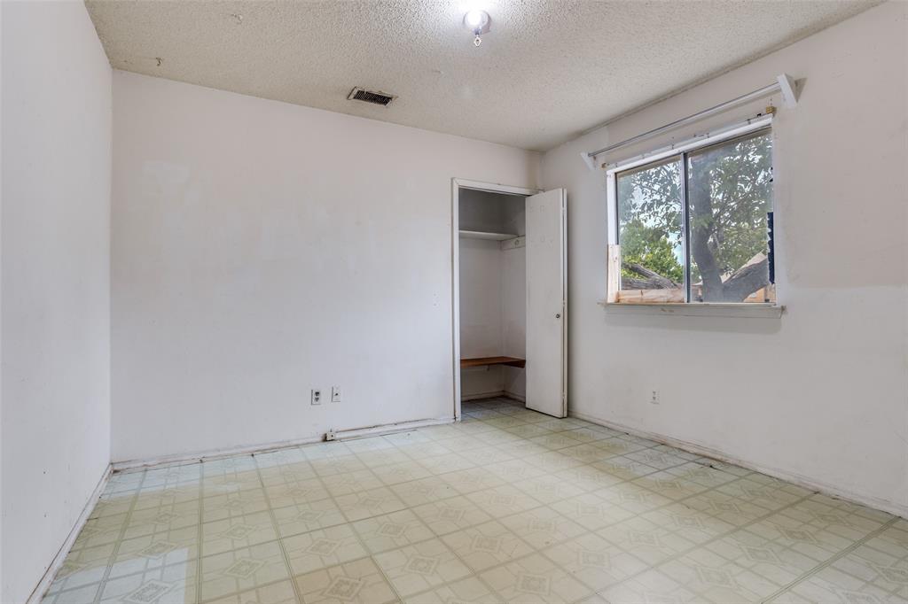 909 East Belt Line Road Richardson, TX 75081 - Photo 8 of 13 an empty room with windows