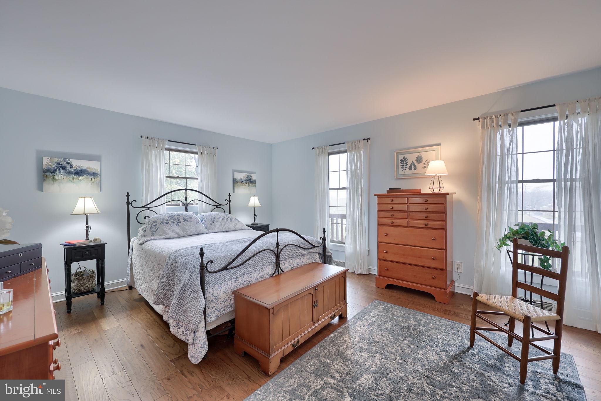 1521 West Penn Grant Road Lancaster, PA 17603 - Photo 21 of 67 a bedroom with a bed table and windows