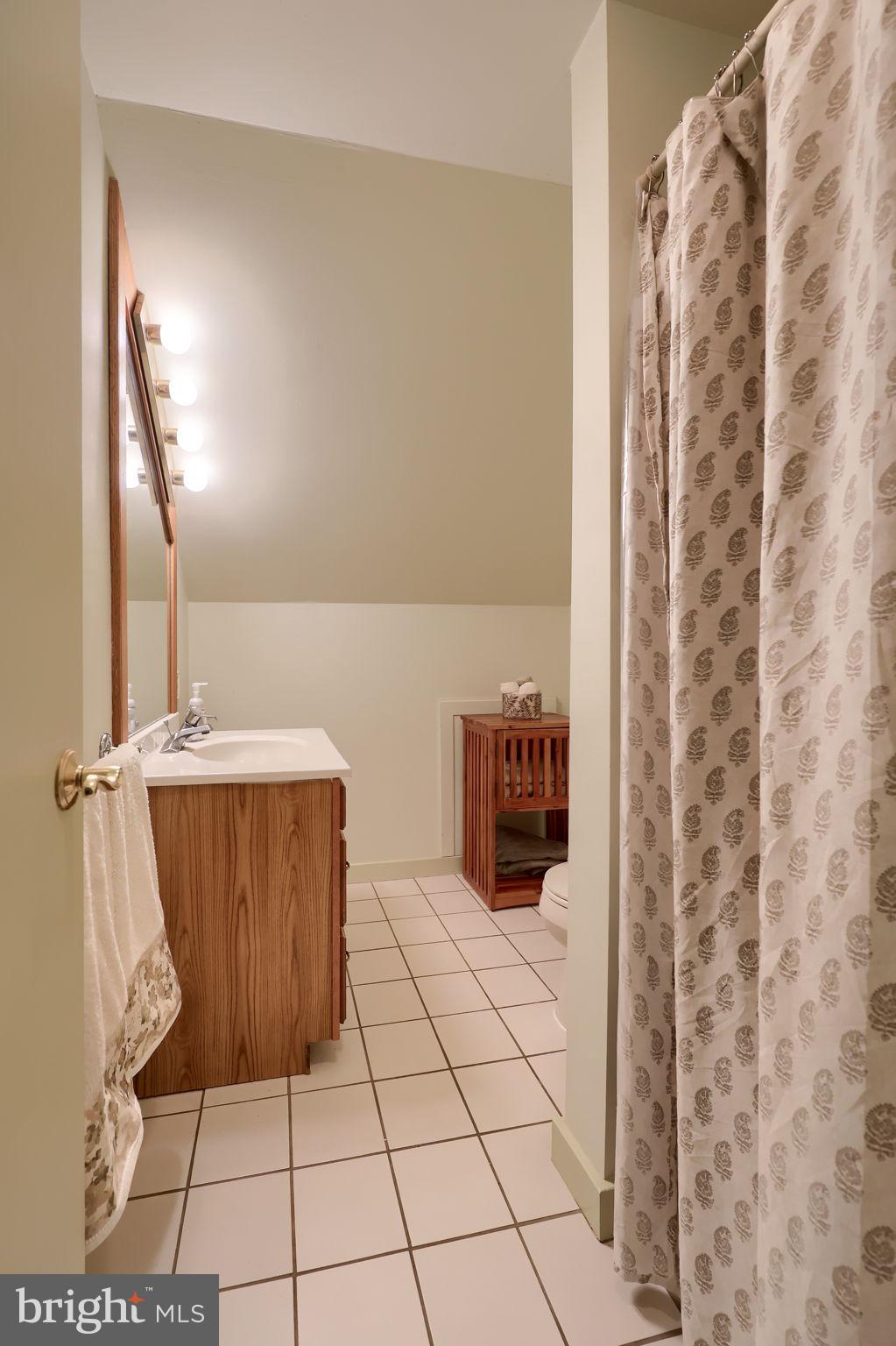 1521 West Penn Grant Road Lancaster, PA 17603 - Photo 35 of 67 a bathroom with a sink and a mirror