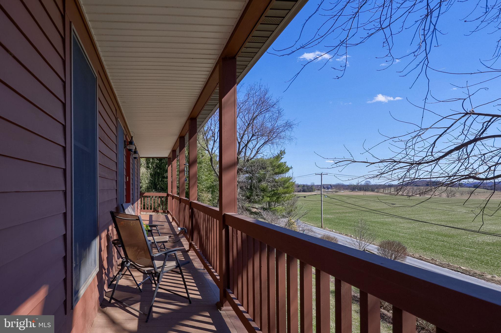 1521 West Penn Grant Road Lancaster, PA 17603 - Photo 41 of 67 a view of a balcony with wooden floor and fence