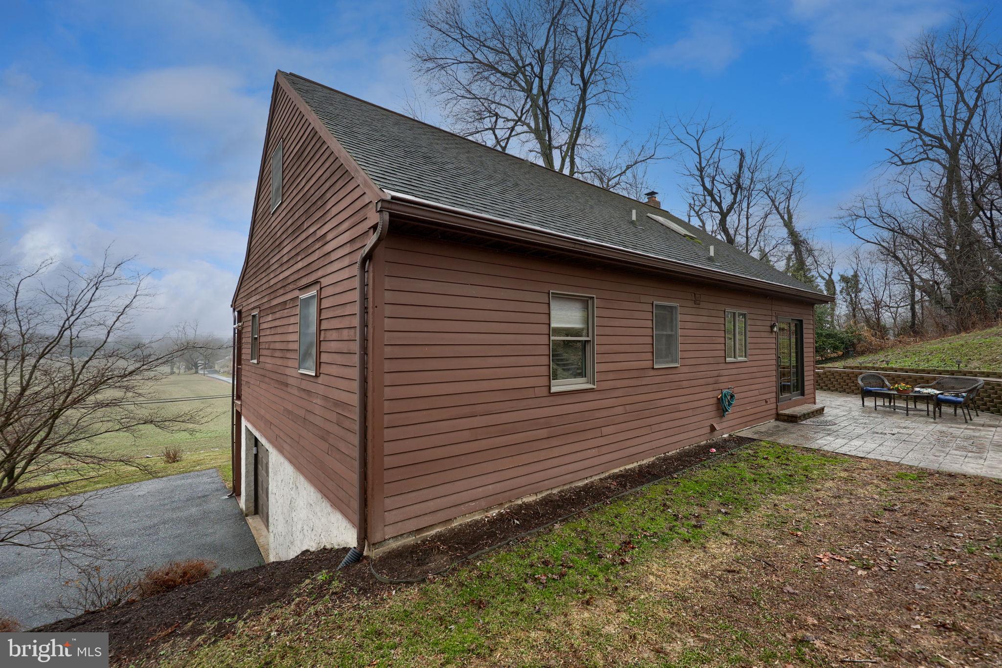 1521 West Penn Grant Road Lancaster, PA 17603 - Photo 50 of 67 a backyard of a house with wooden fence and large tree