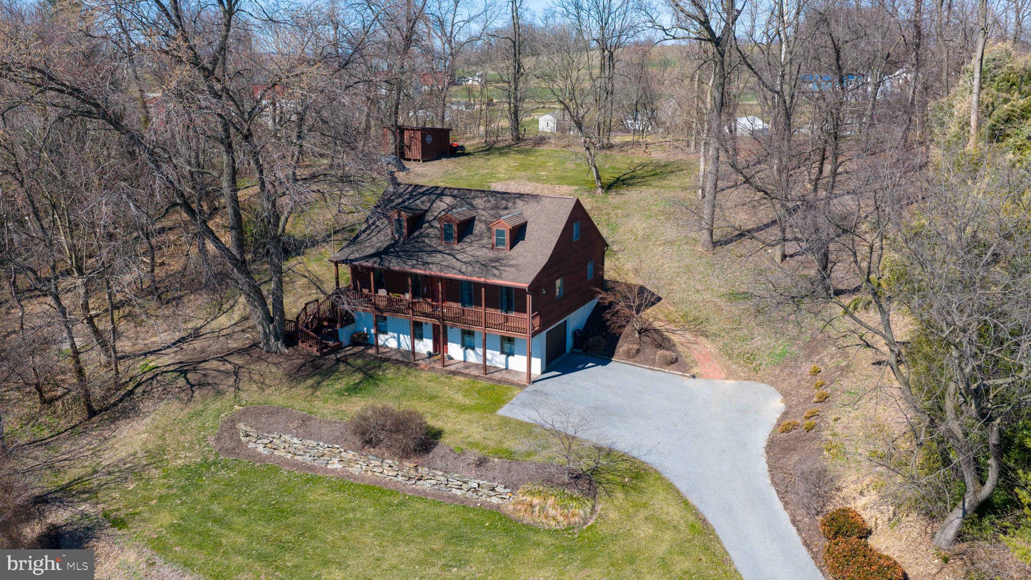 1521 West Penn Grant Road Lancaster, PA 17603 - Photo 58 of 67 a view of a house with a yard and sitting area