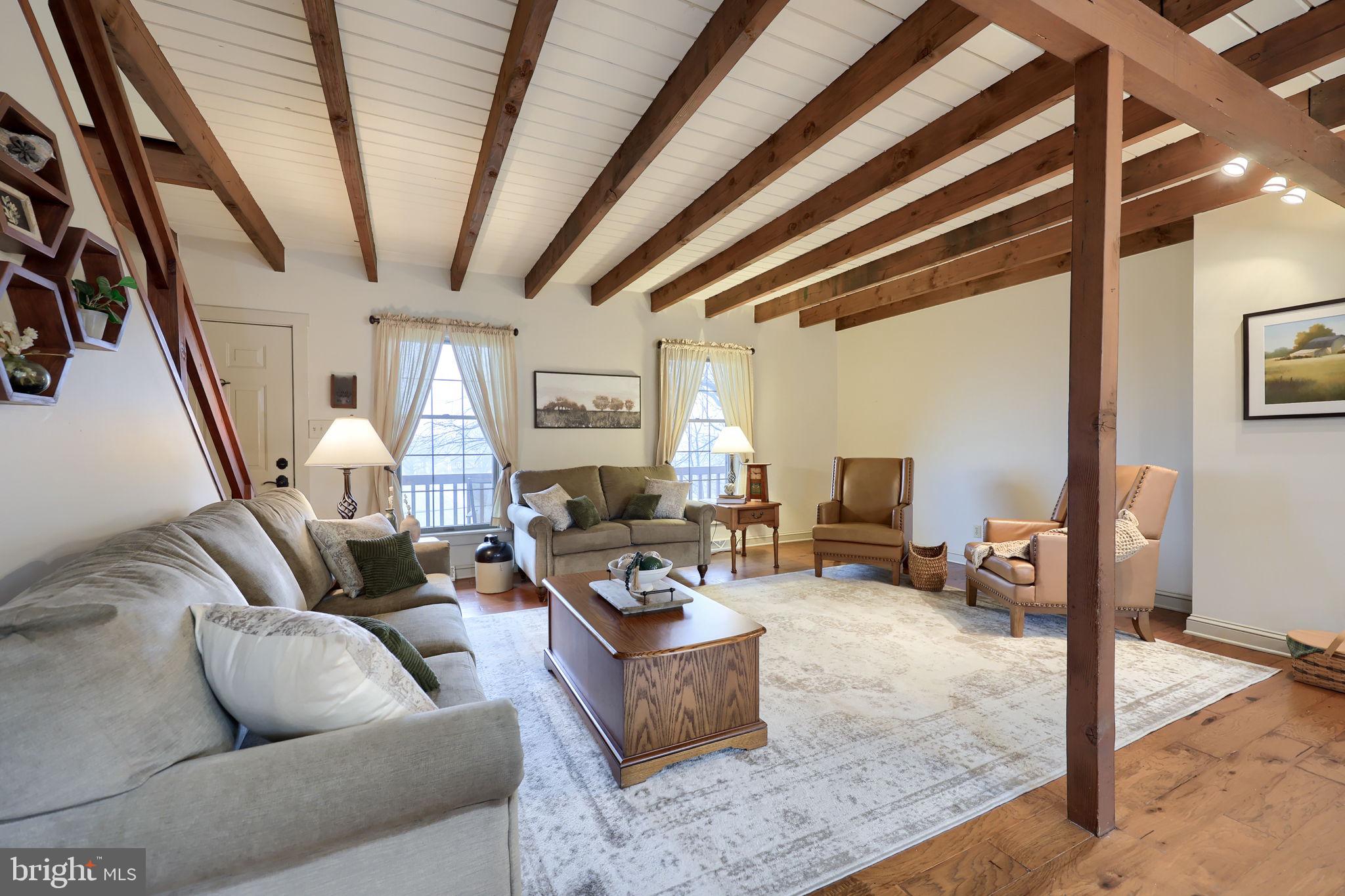 1521 West Penn Grant Road Lancaster, PA 17603 - Photo 7 of 67 a living room with furniture and a chandelier