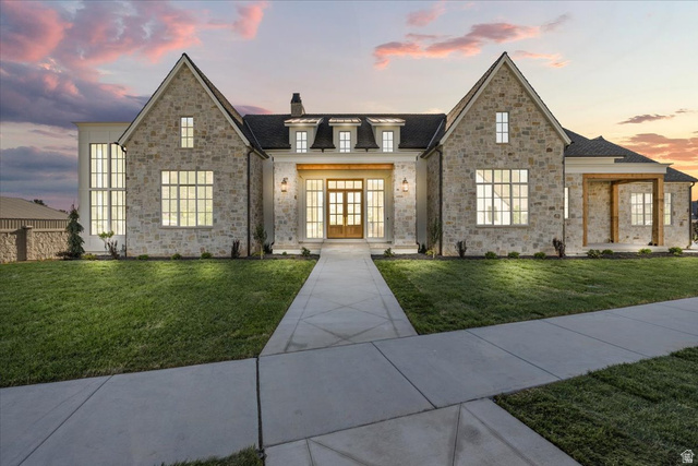 Stone facade residence with a prominent gabled roofline