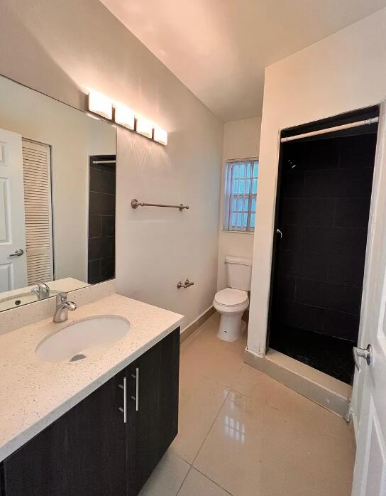 950 Lake Wyman Road, Unit A Boca Raton, FL 33431 - Photo 3 of 5 a bathroom with a sink and a mirror