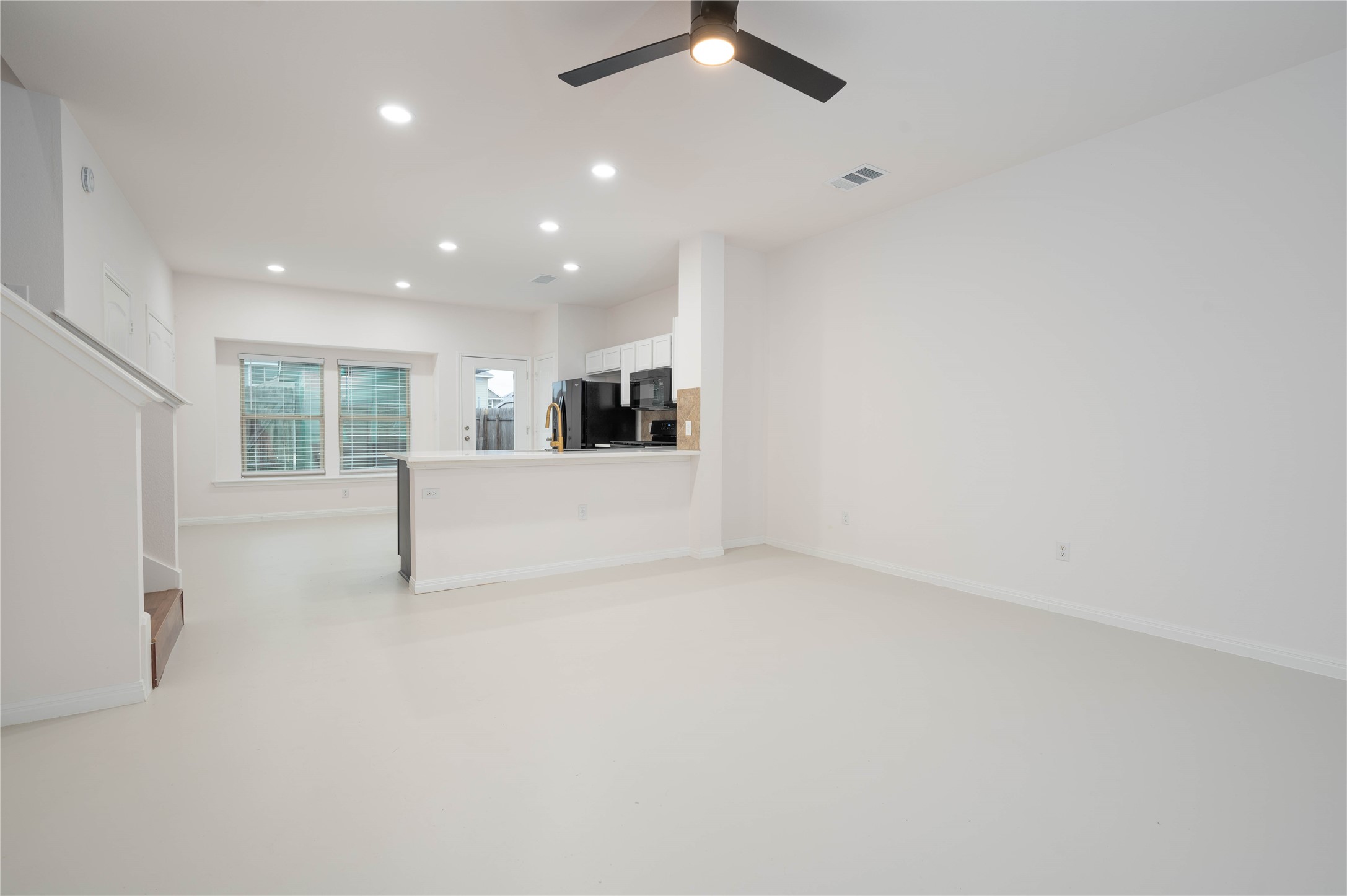 4514 Truth Way Austin, TX 78725 - Photo 4 of 20 Unfurnished living room with ceiling fan