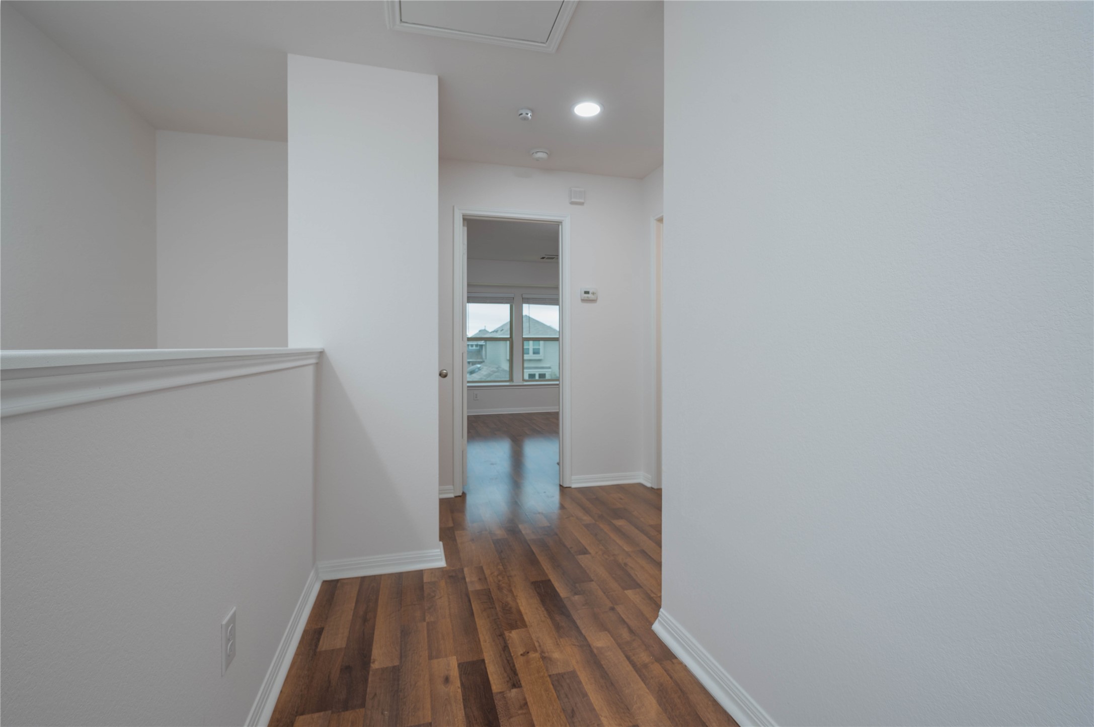 4514 Truth Way Austin, TX 78725 - Photo 9 of 20 Hall featuring dark wood-type flooring